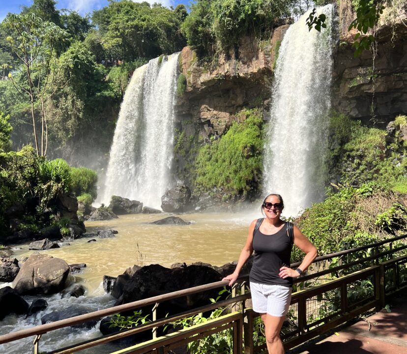 Luxury female traveler at Iguazú Falls National Park Argentina.