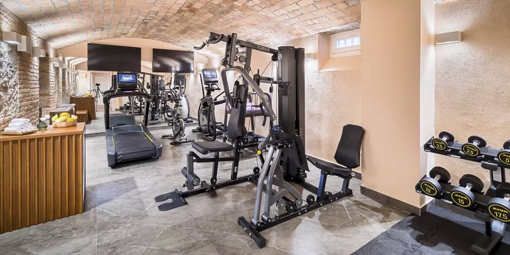 A well-equipped gym at the luxury hotel with a variety or machines and equipment.