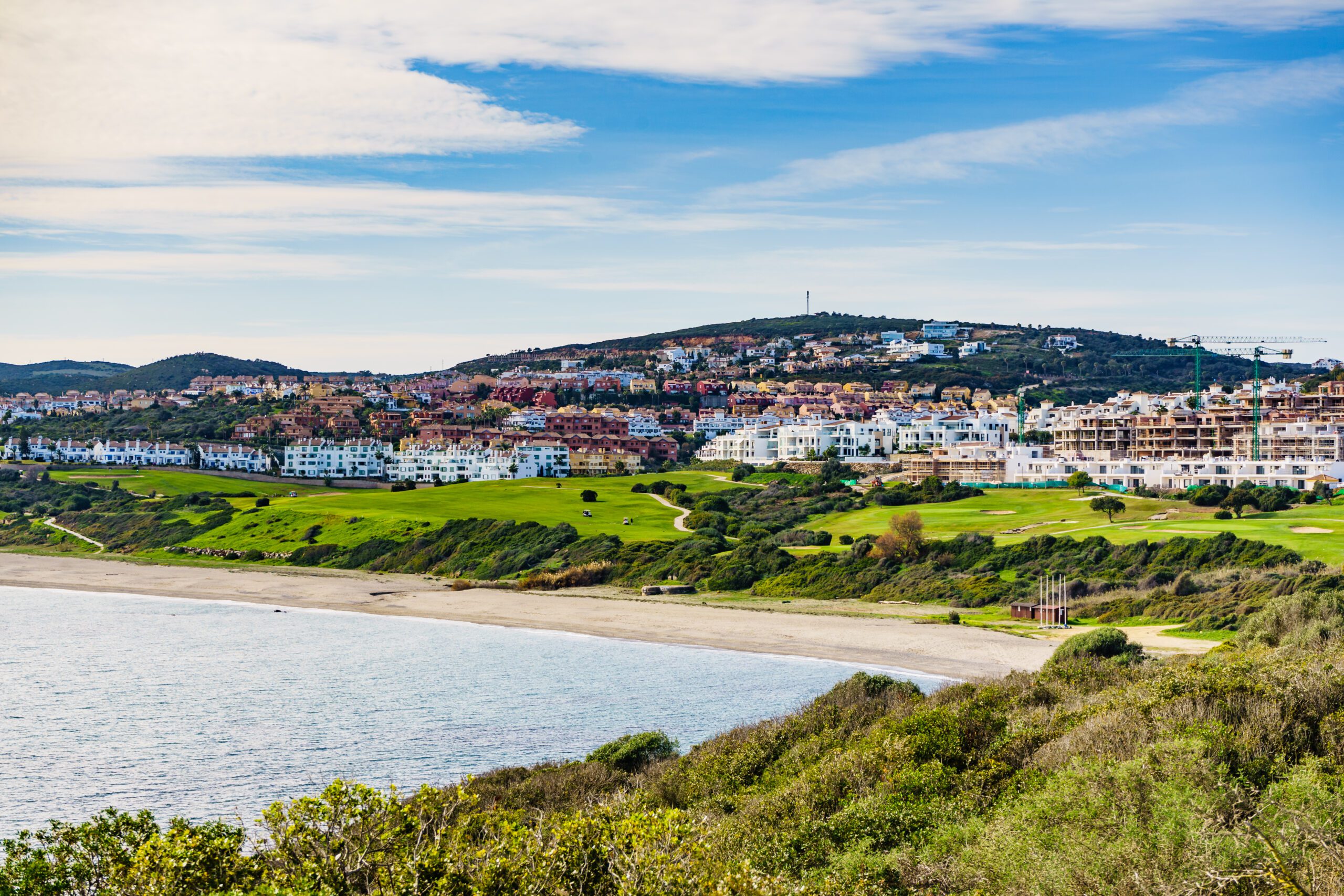 Alcaidesa beach image from the headlands showing Alcaidesa urbanization behind