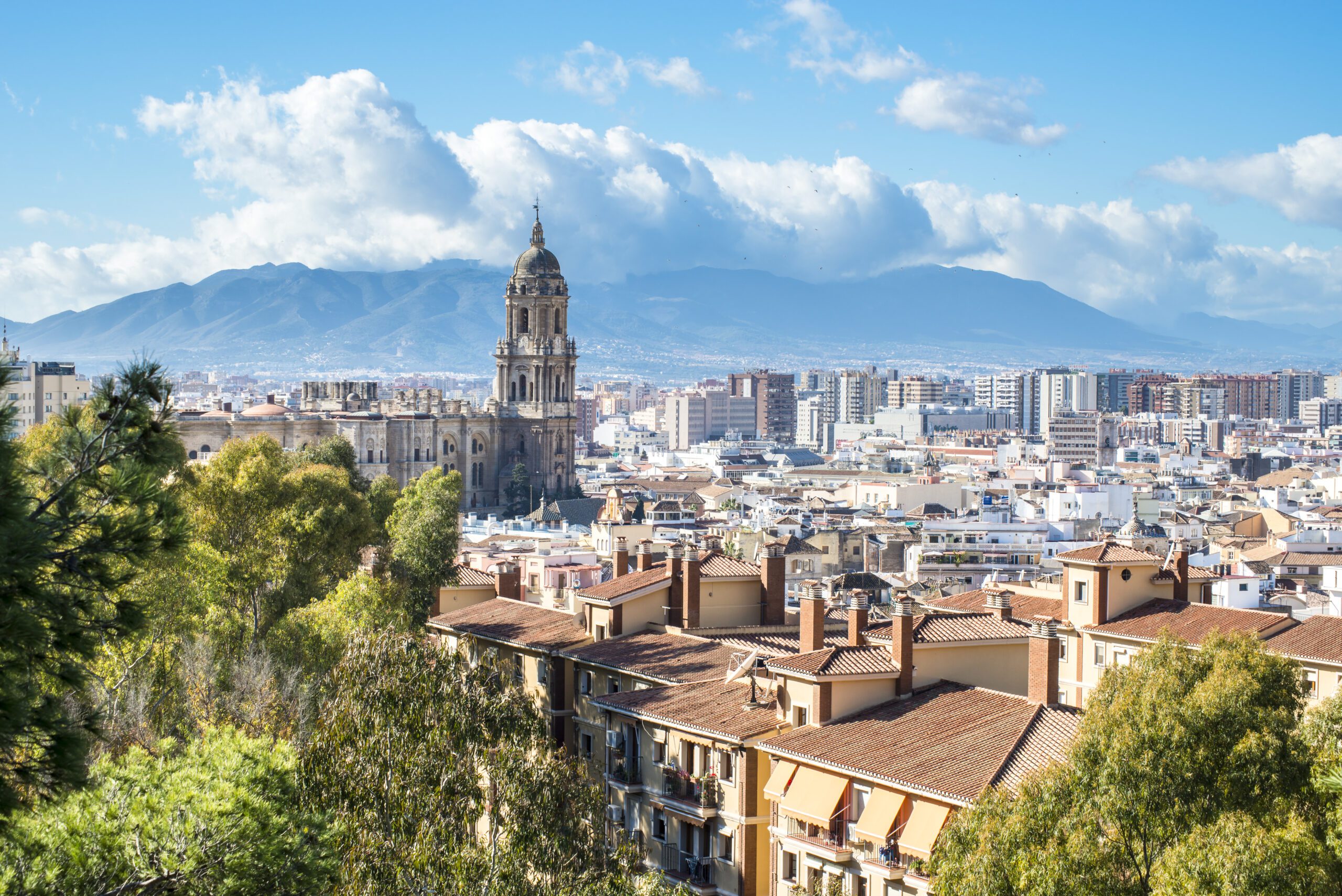 A view of the Cathedral of Malaga with the mountains of Malaga behind.