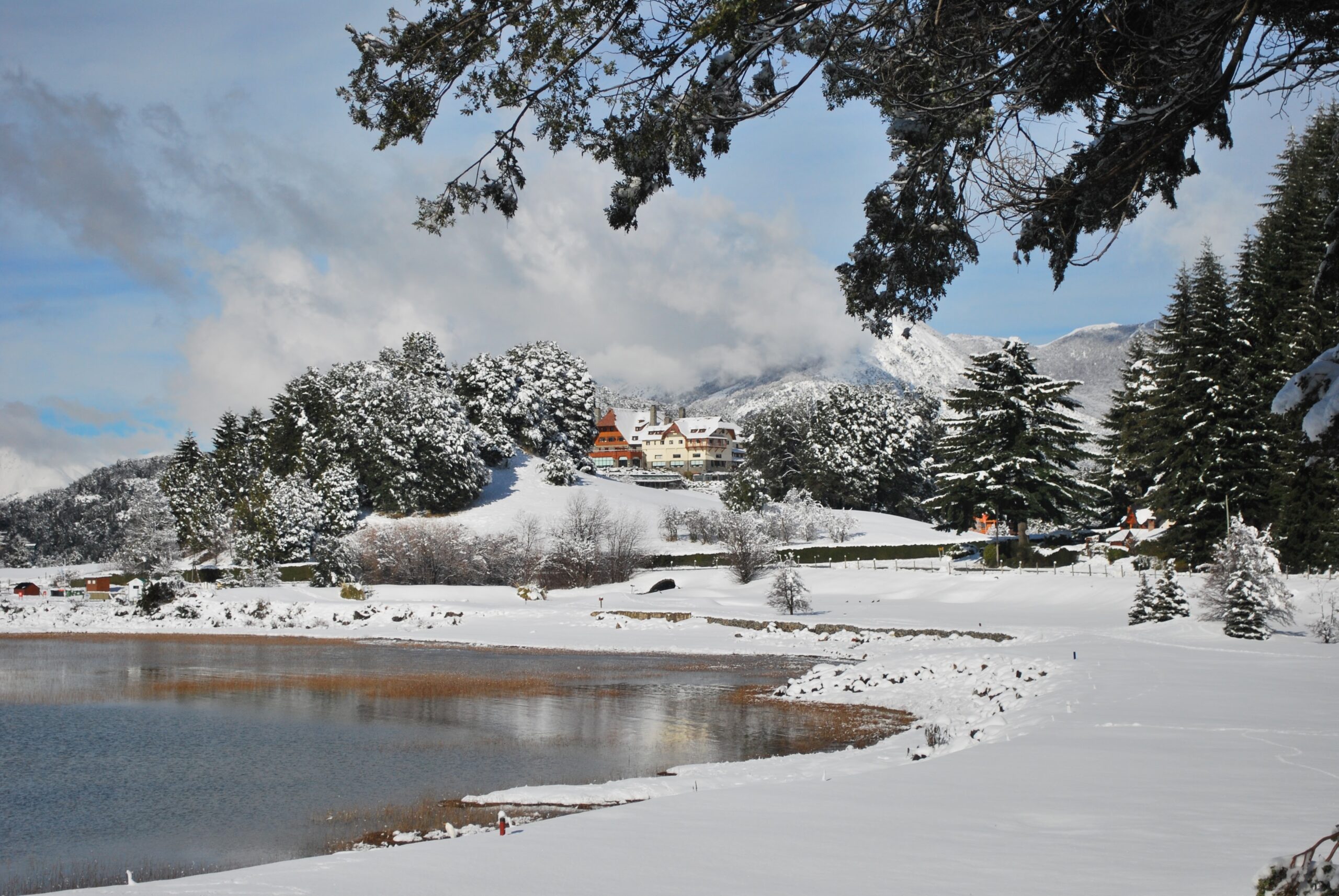 A view of the luxury hotel in a beautiful snowy landscape.