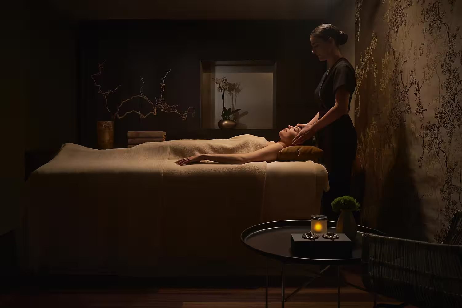 A woman enjoying a luxury spa treatment at Mandarin Oriental Spa.