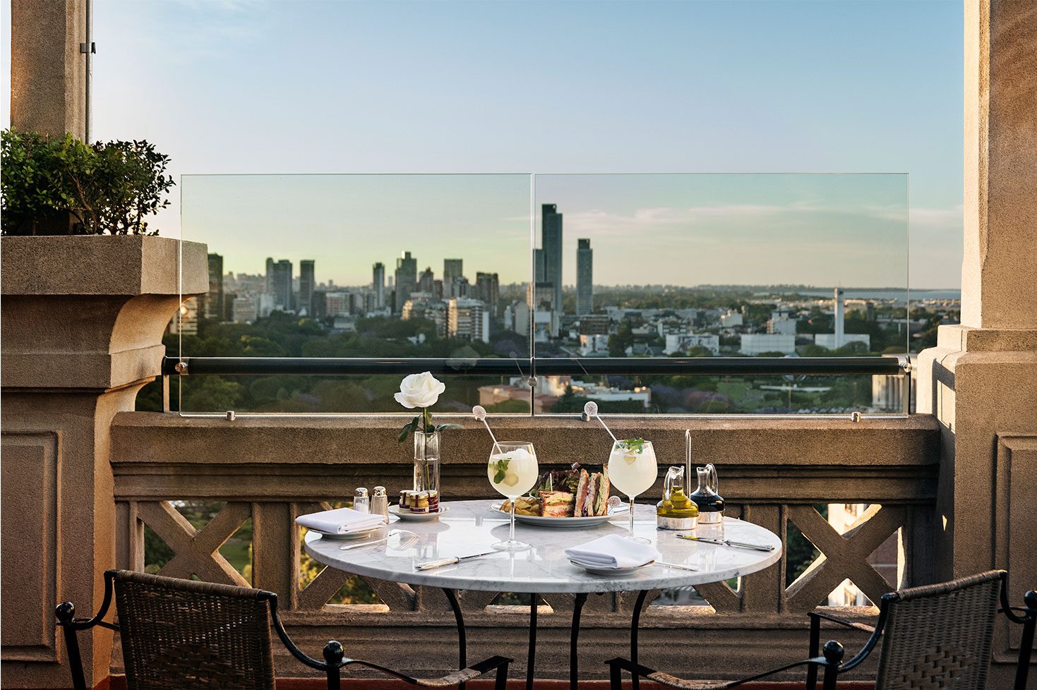 A dining table on a terrace at the luxury hotel with stunning views of Buenos Aires.