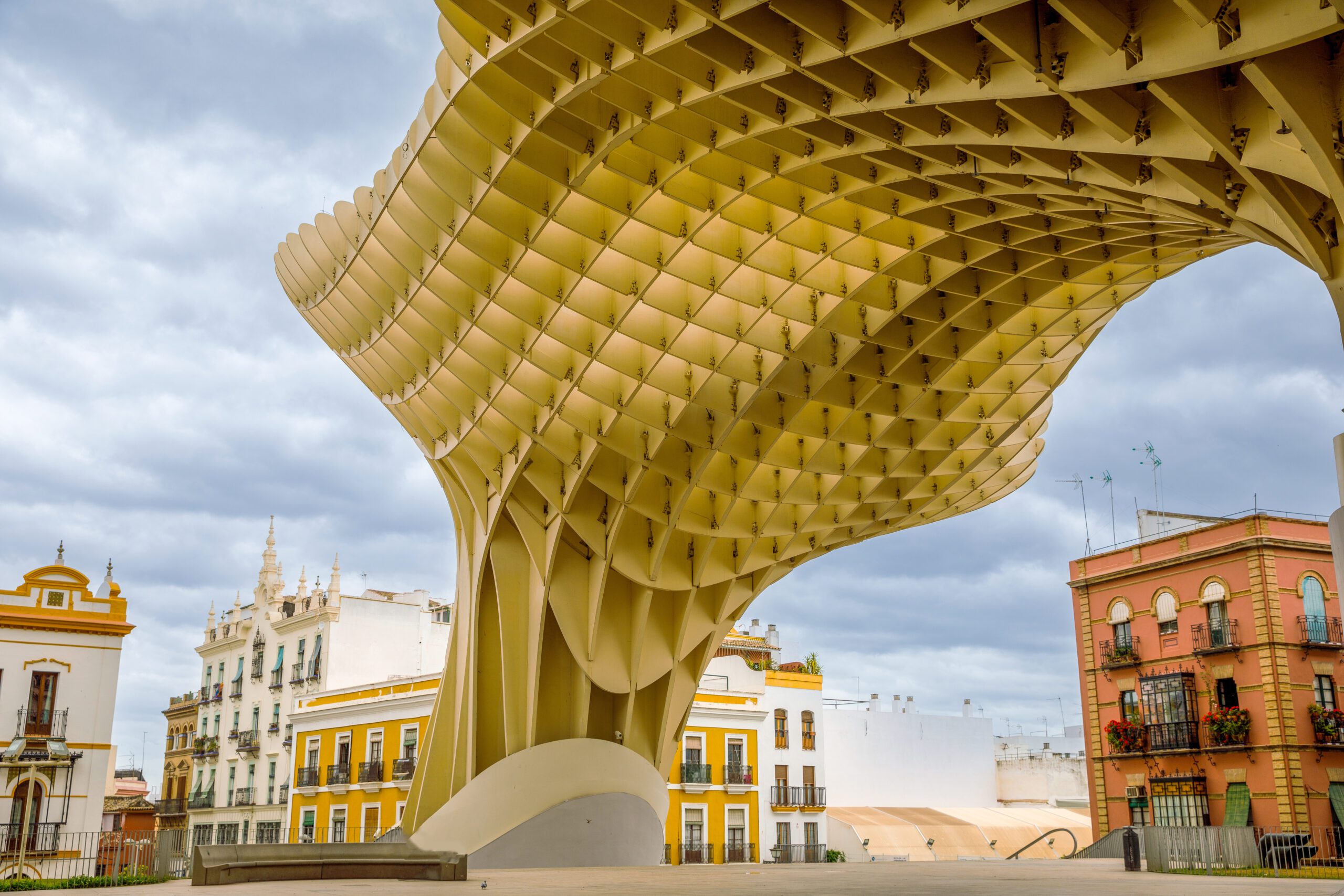 Under the Metropol Parasol Wodden structure which appears as a cubed honeycomb structure with a wavy outer form. Located in Seville, Andalucia, Spain