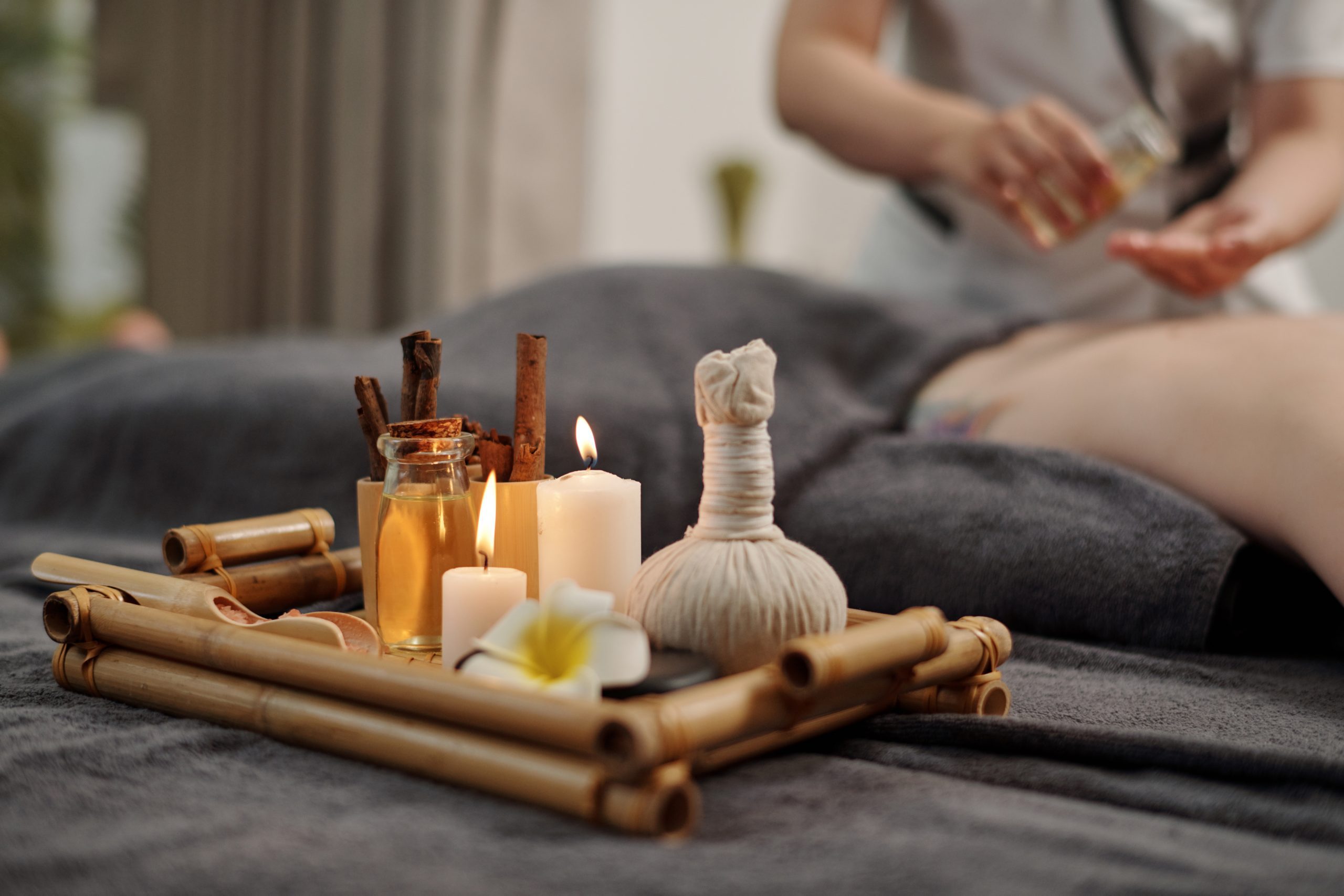 Tray with candles and oils for massage spa procedures.