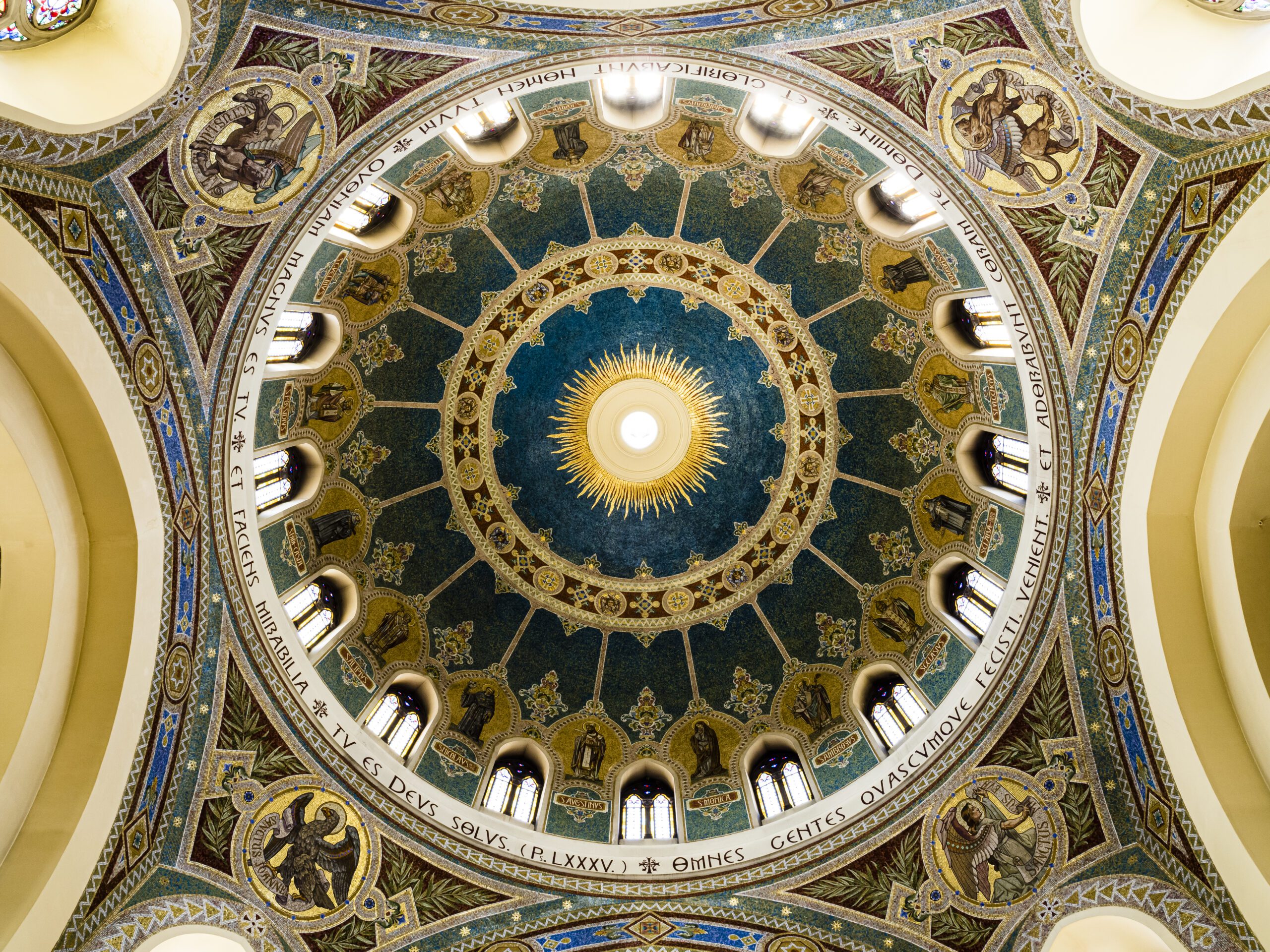 The ornate ceiling with gold and blue paintwork found on the Interior of parish of San Manuel and San Benito, Madrid, Spain