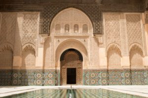 Courtyard with pool at entrnace to Ben Youssef Medrassa in Marrakech