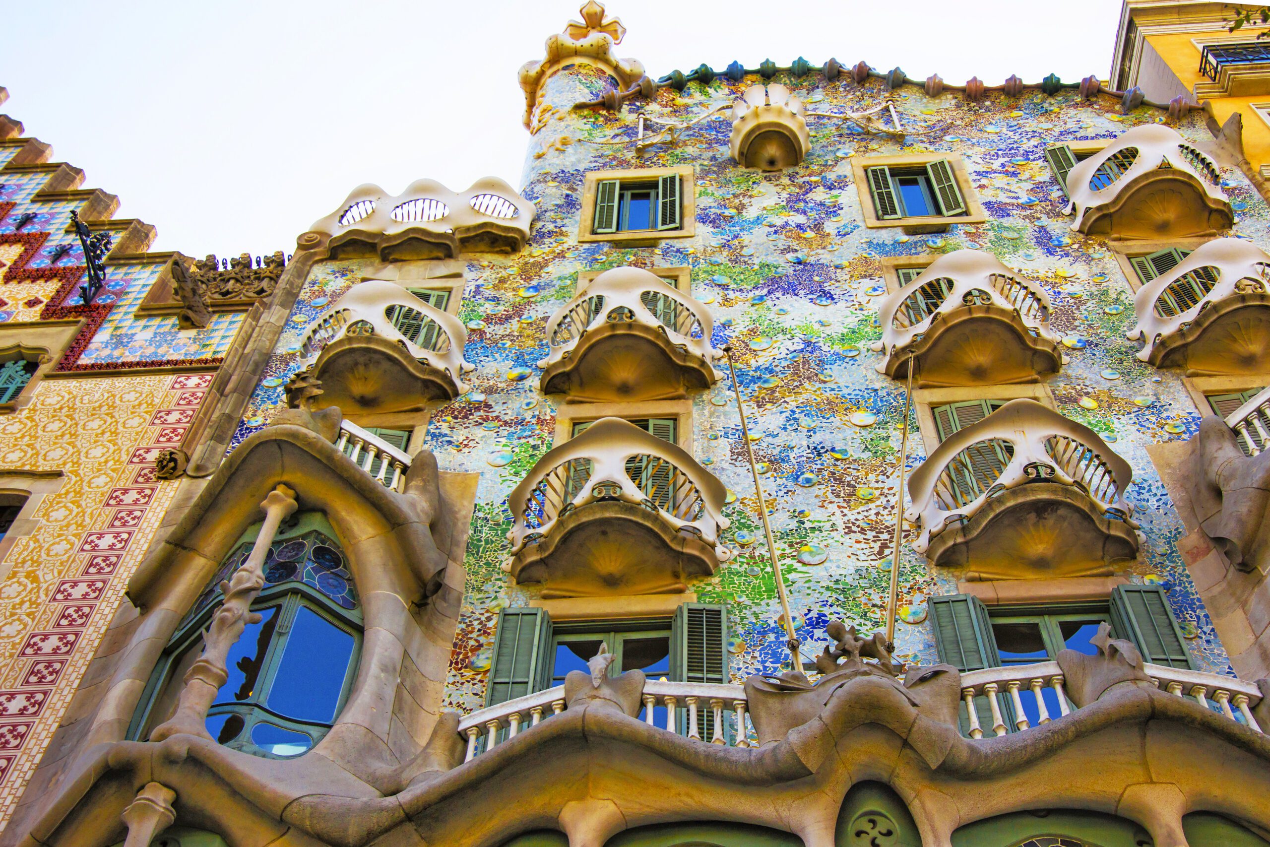 The balconies of Casa Batilo, designed by Antoni Gaudí with brightly coloured mosaics covering the walls.