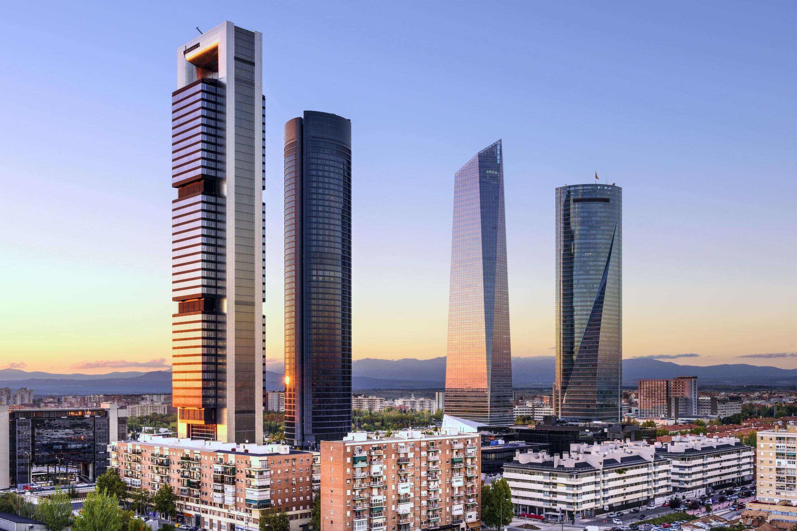 Modern buildings located in Madrid, Spain in the financial district with the skyline at dusk.