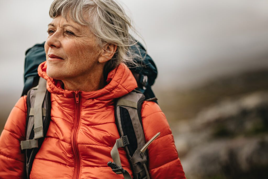 Mature solo female traveller on a hike