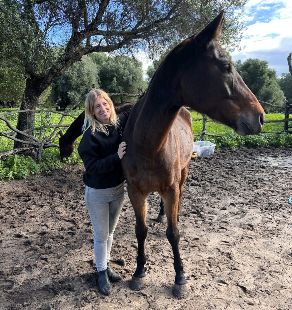 Anais who runs Arion coaching with one of the horses