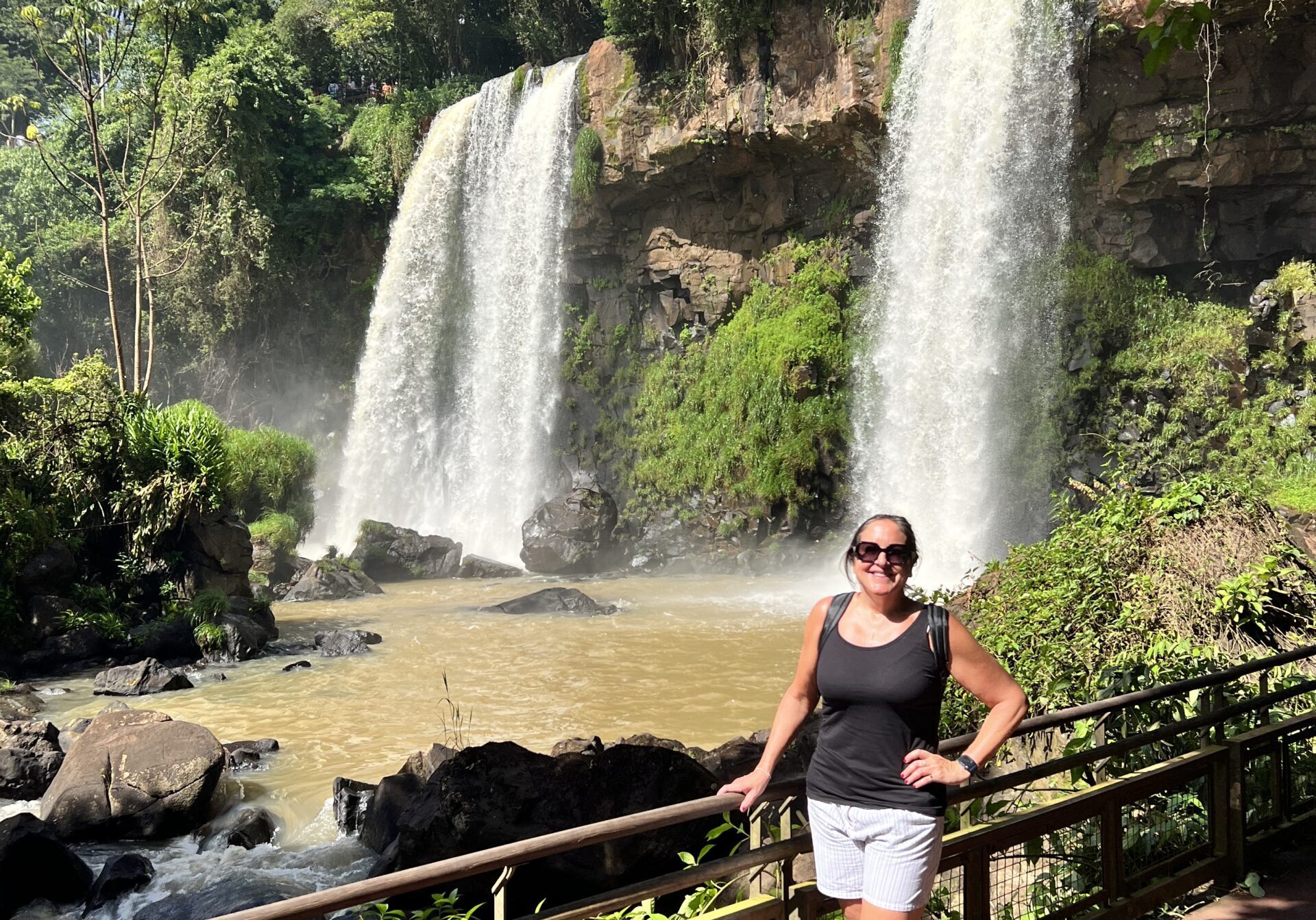 Luxury female traveler at Iguazú Falls National Park Argentina.